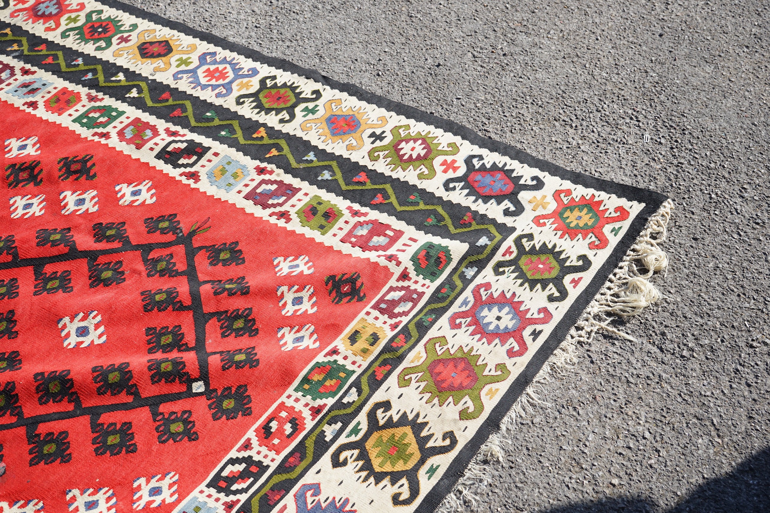 A Kilim polychrome flatweave carpet, approx. 280 x 240cm